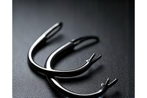 A cluster of three sharp treble hooks, silver and gleaming