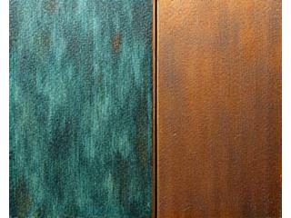 Close-up of bronze sculpture with green patina